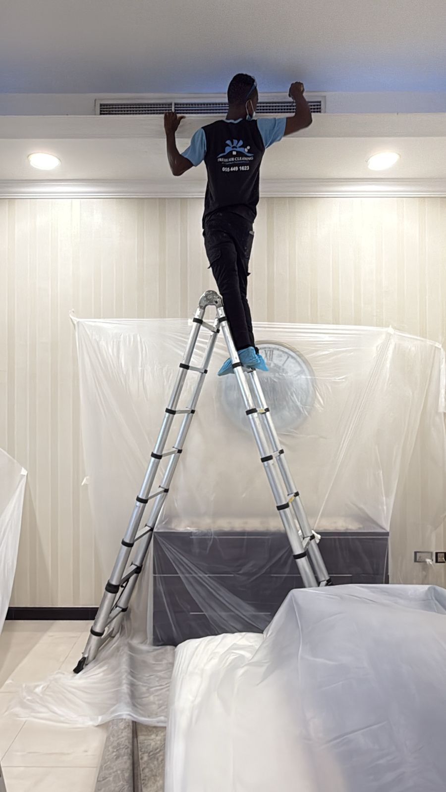 Fresh Air Cleaning certified technician performing AC duct cleaning in Dubai.